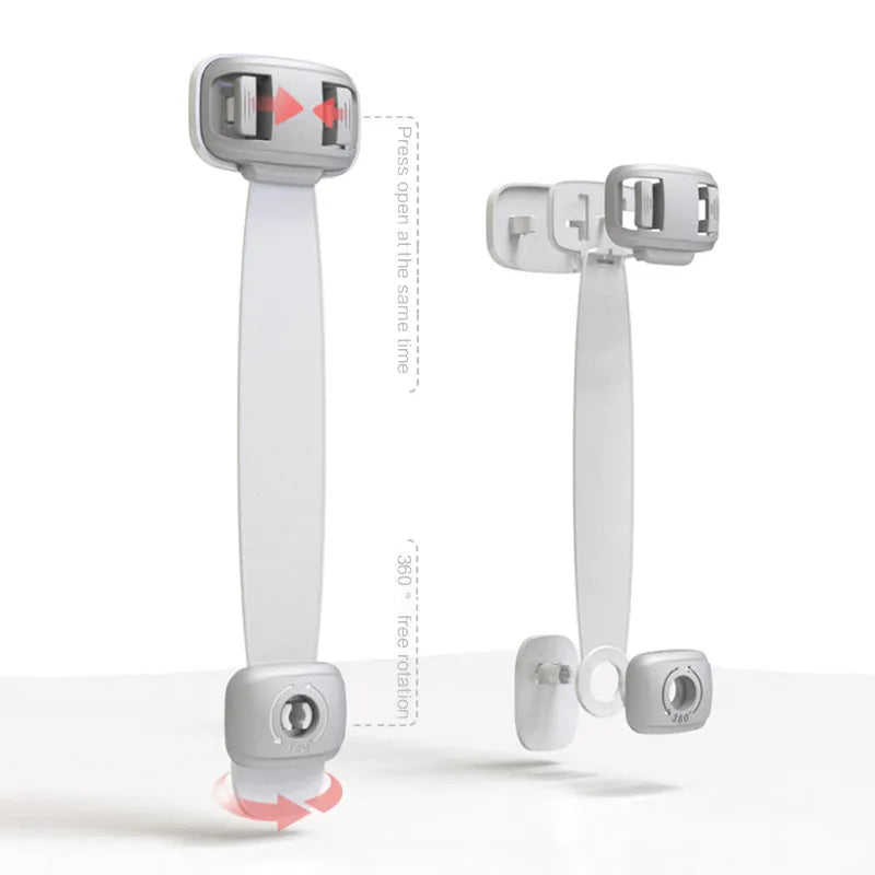 Gray child safety lock with adjustable strap attached to a cabinet handle, 53 x 112 x 16mm