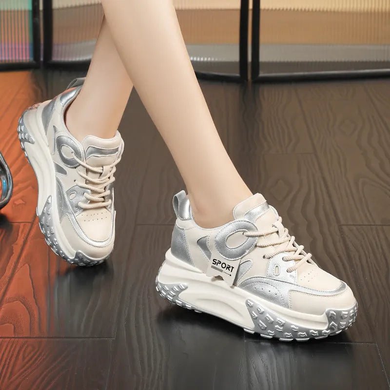 Leather sports casual shoes with thick sole and wedge heel, in black and white colour with front lace-up.