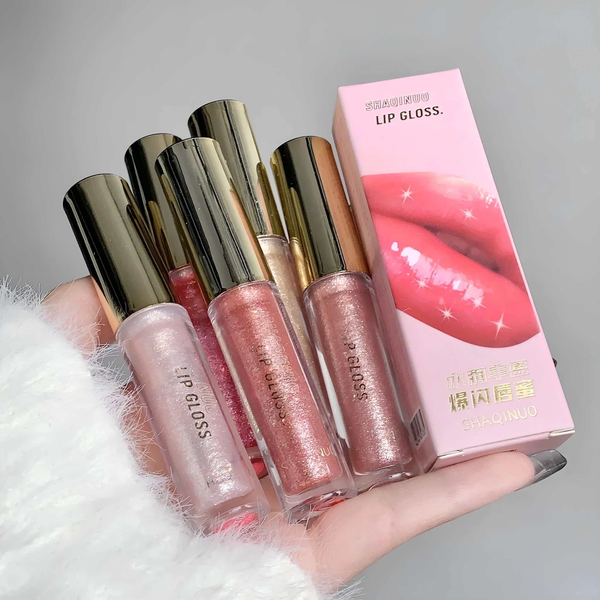 Moisturising rich flash lip gloss in cherry blossom powder, standard tube with water light mirror finish