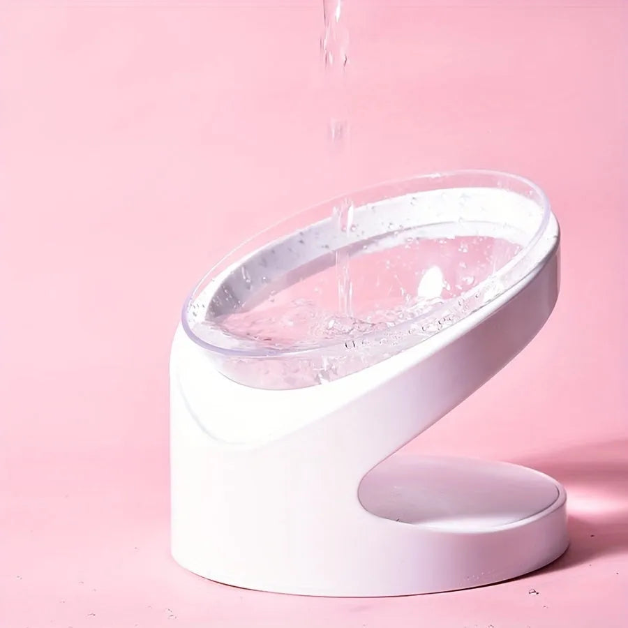 Clear plastic elevated cat food bowl with 15-degree tilt angle on white background