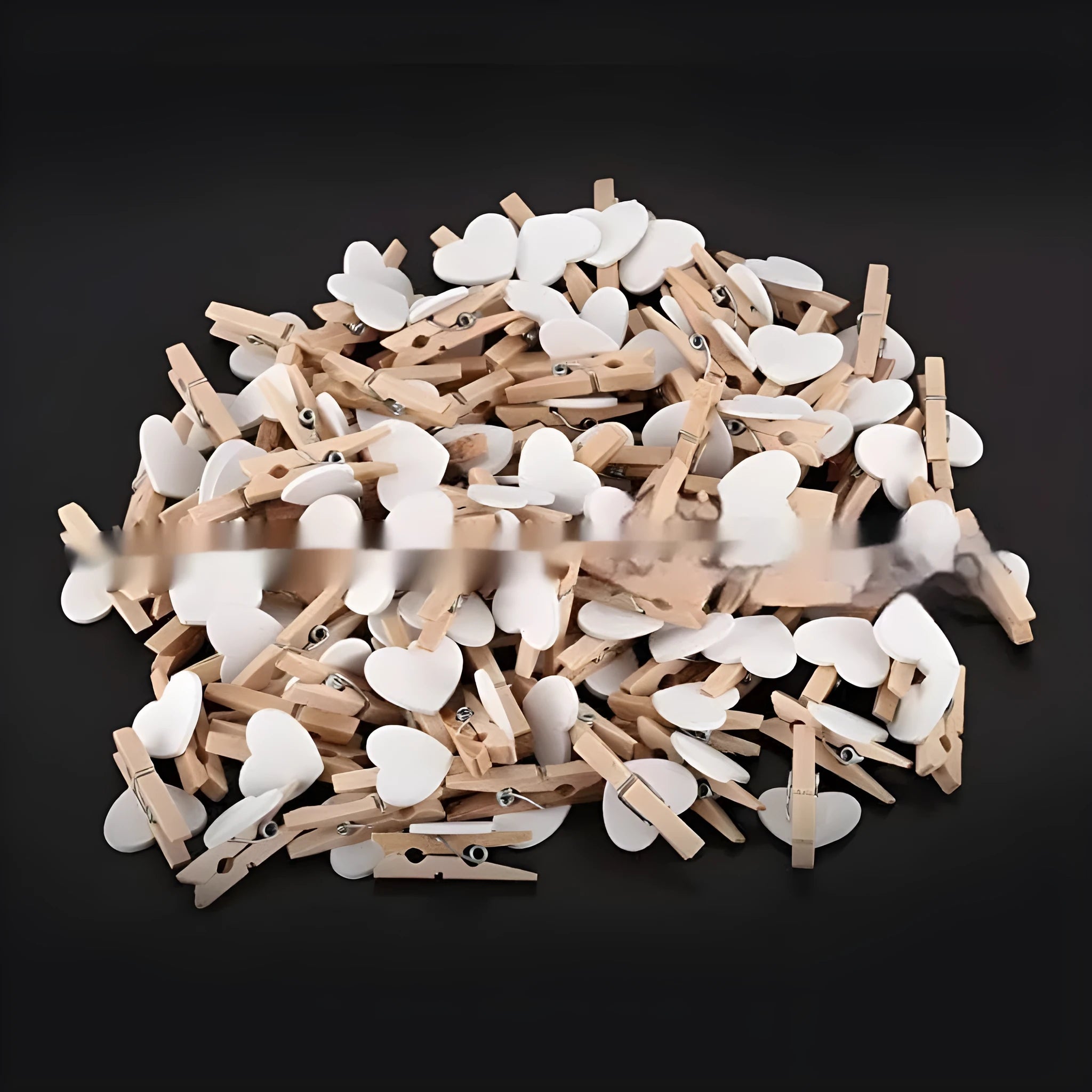 Five solid wood heart-shaped clips in red colour arranged together