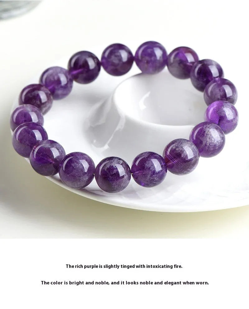 Natural feather amethyst crystal bracelet in Snow Mountain purple with scattered beads and Ruyi element.