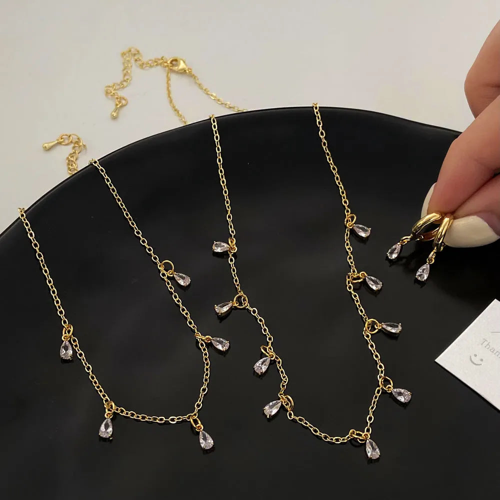 Women's zircon jewellery set with necklace, earrings and anklet in geometric meteor shower design