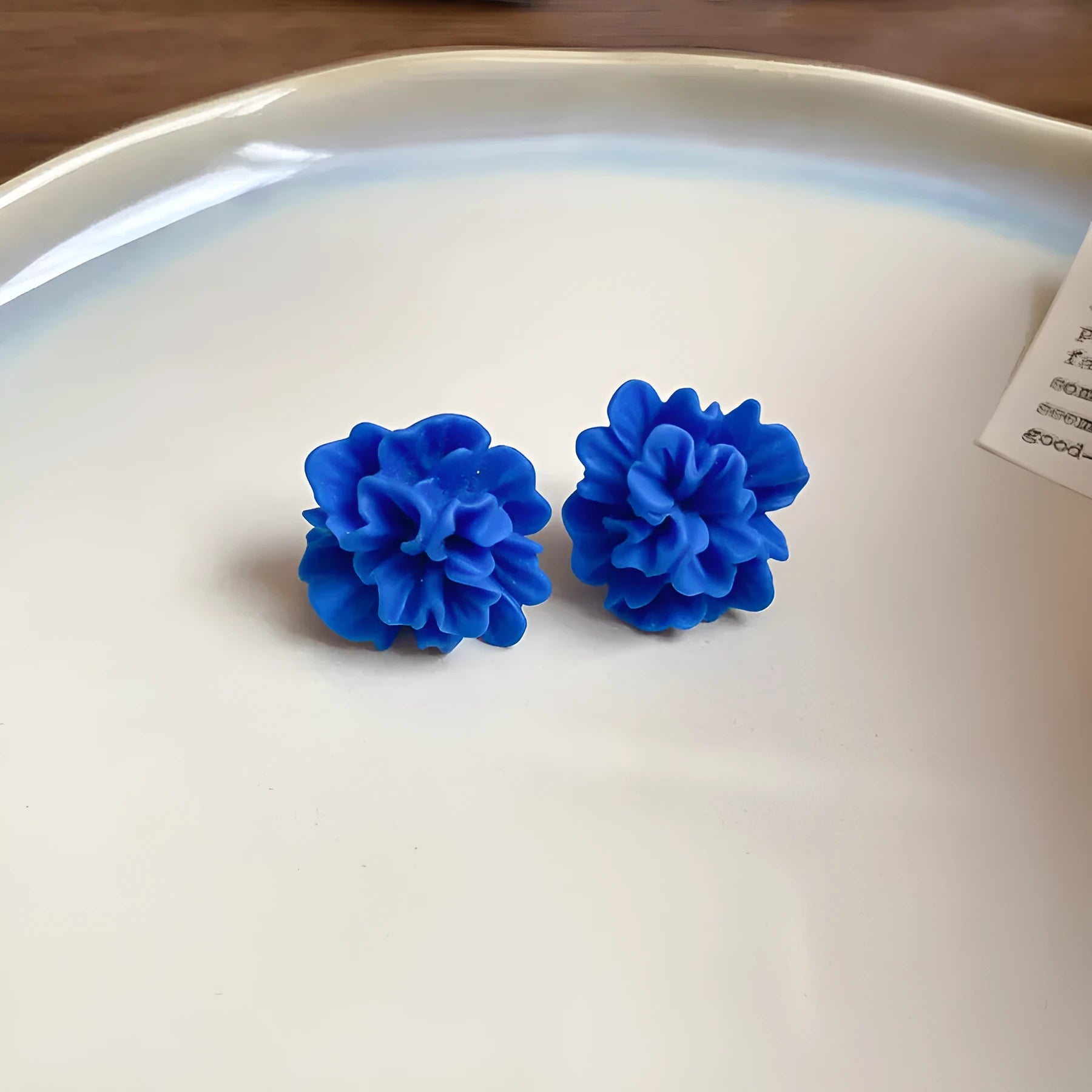 Geometric cloth earrings for women in 30 Silver Needle-blue resin flower colour, showing manual craftsmanship.
