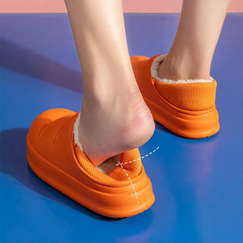Women's waterproof EVA winter house slippers in multiple colours with plush lining and non-slip sole.