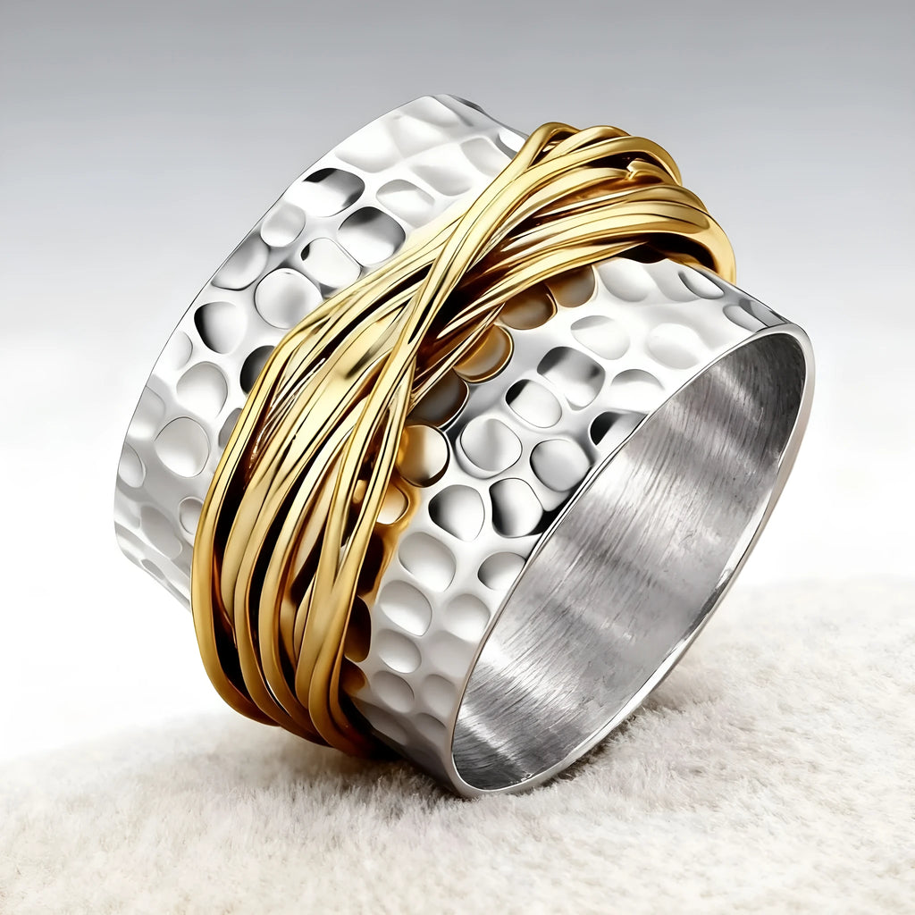 Alloy two-tone ring with hammered metal coil design, electroplated finish, on white background