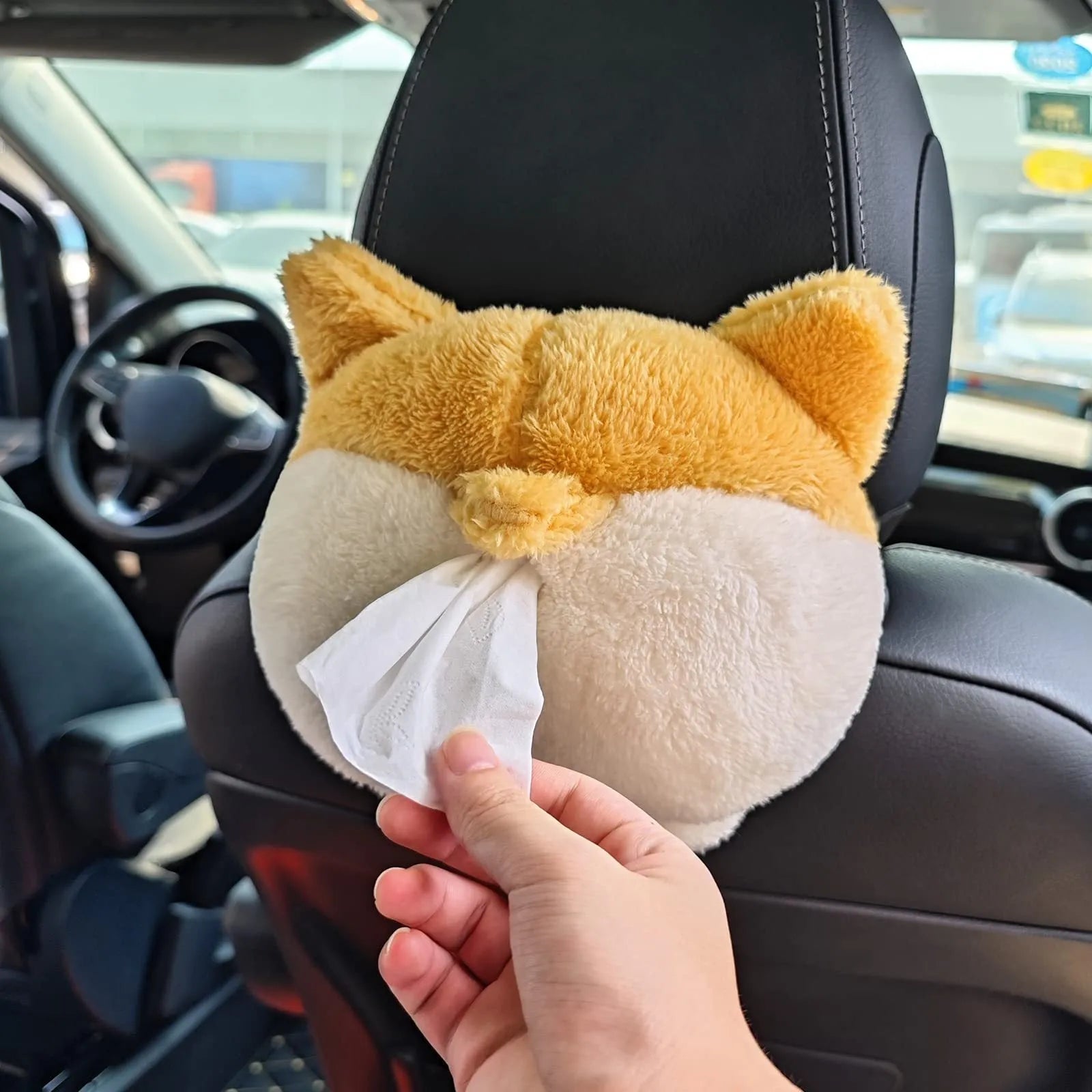 Yellow corgi butt-shaped soft tissue box cover with elastic strap for car sun visor.