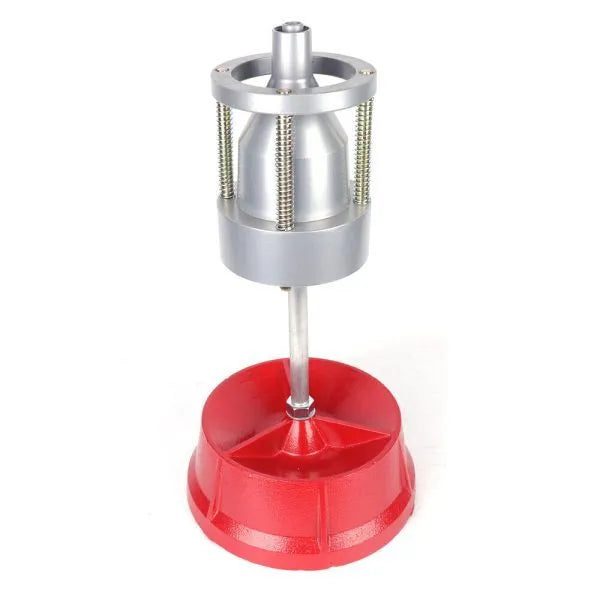 Portable manual hub balancer with aluminium head and bull's eye level on enamel base.