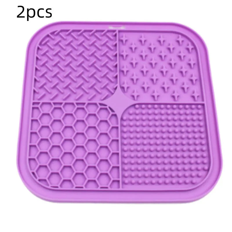 Green silicone pet licking pad 20x20cm with suction cup base on a tiled floor