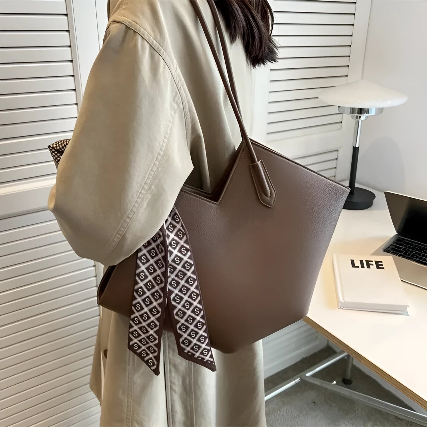 Women's large black PU leather shoulder bag with a sandwich pocket, shown next to a brown version.