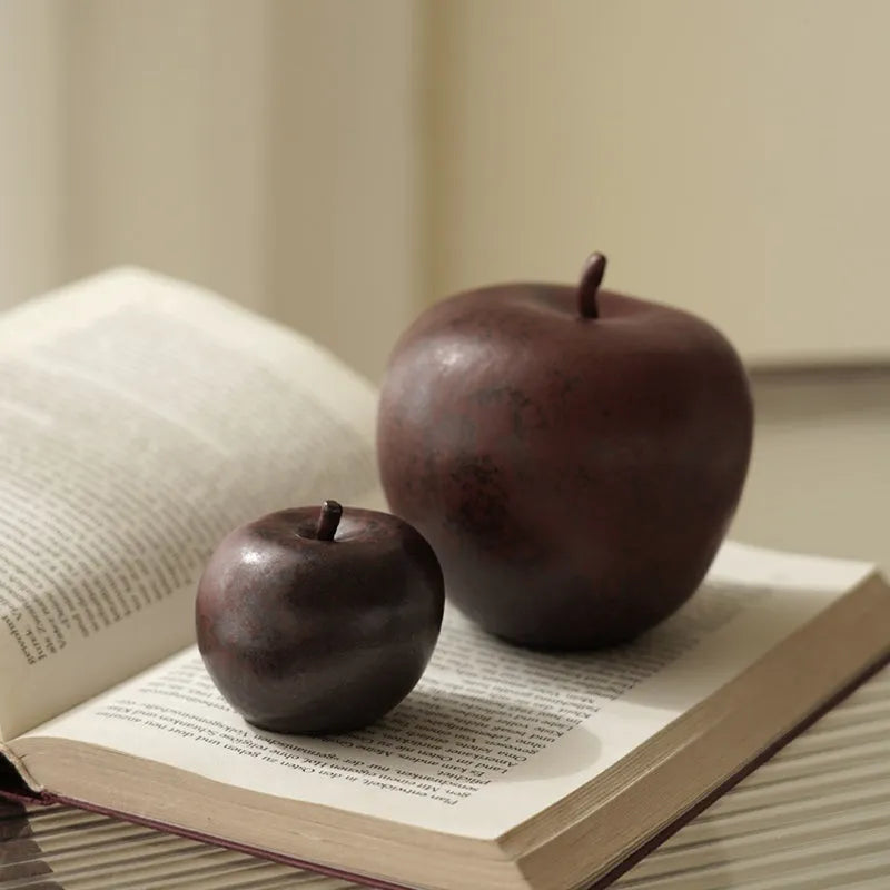 Retro Chinese style ceramic simulation apple ornament for desktop decoration on a wooden surface.