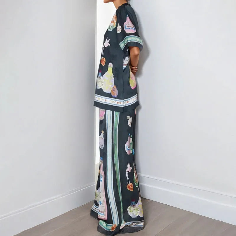 Black women's casual set with cartoon print, featuring a cardigan and trousers