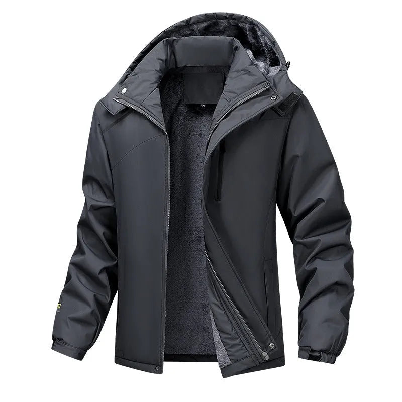 Man wearing a dark grey waterproof hooded plus-size coat outdoors.