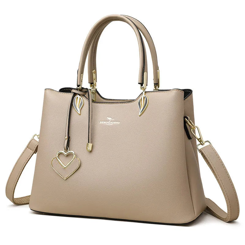 Women's black PU messenger bag with cross-body strap and multi-layer interior compartments.