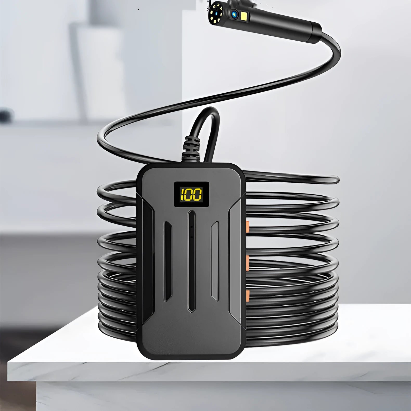 F300 WiFi dual lens endoscope inspection camera with magnet and hook accessories on a table