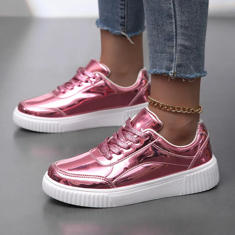 Gold sequined platform sneakers with round toe and thick MD sole on a white background.