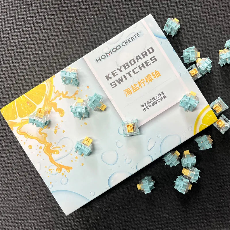 36 clear mechanical keyboard switches with Sea Salt Lemon coloured stems arranged in packaging.