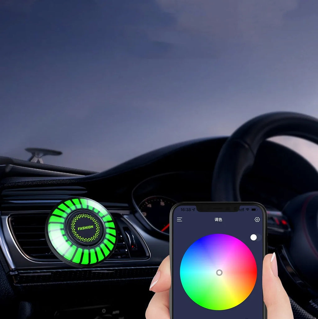 Car air vent aromatherapy diffuser with RGB LED lights mounted on vehicle air outlet