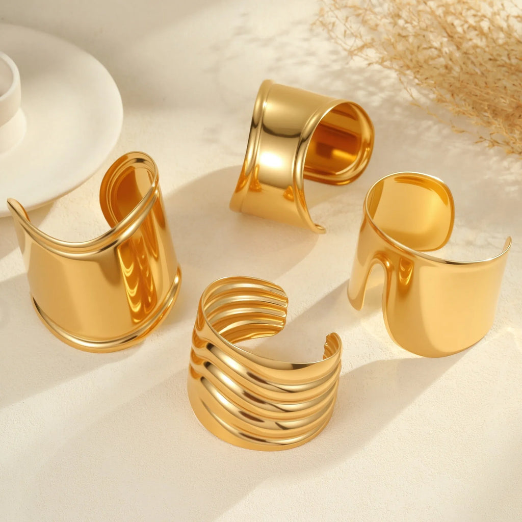 Women's gold plated stainless steel bracelet with geometric wave design and niche opening fastening