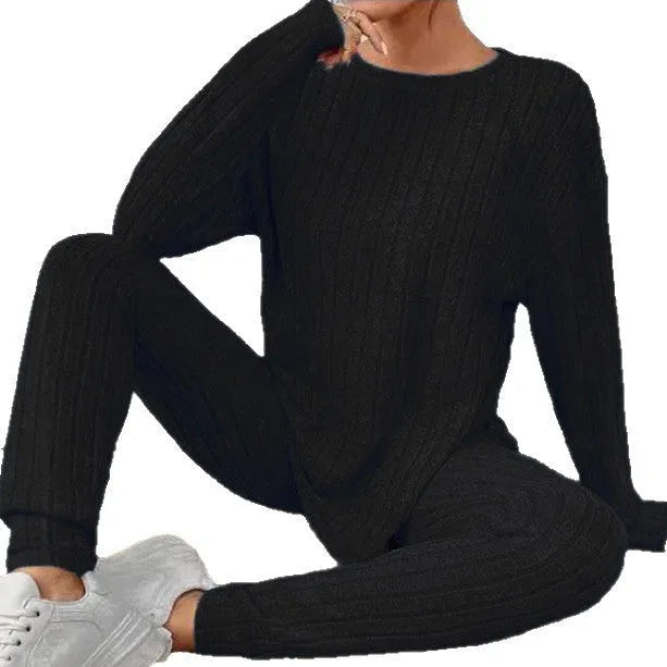 Women's black sunken stripe polyester two-piece loungewear set with regular sleeve top and matching trousers