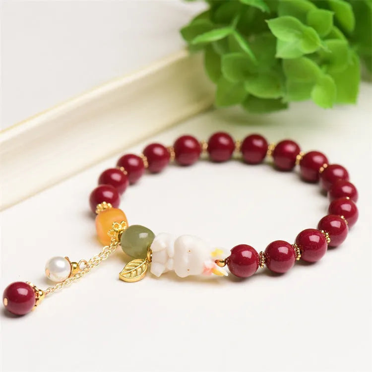 Natural cinnabar rabbit charm bracelet in Chinese national style, available in 8mm or 10mm diameters