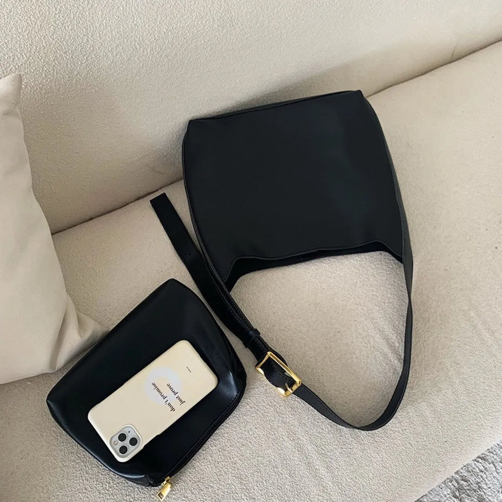 Women's soft PU shoulder bag with swing threads in black ribbon or brown colour options