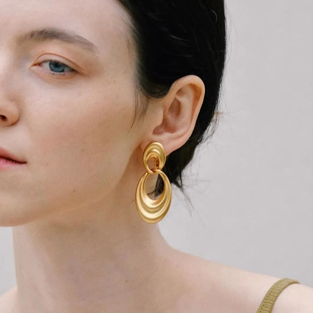 Gold double circle French retro earrings with U-shaped silhouette and quicksand-coloured finish