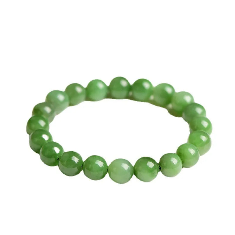 Natural Hetian jade and jasper bead bracelet showing polished spherical beads on a wrist.
