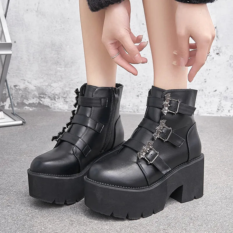 Black women's punk Martin boots with bat buckle, thick heel, and side zipper.
