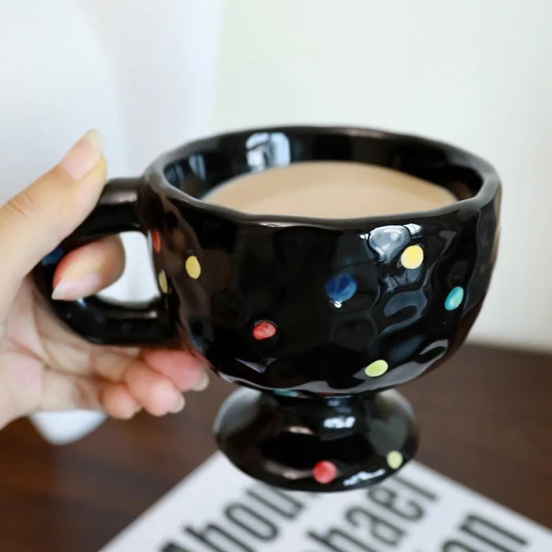 Hand-pinched irregular ceramic mug in solid colour with modern simplicity design