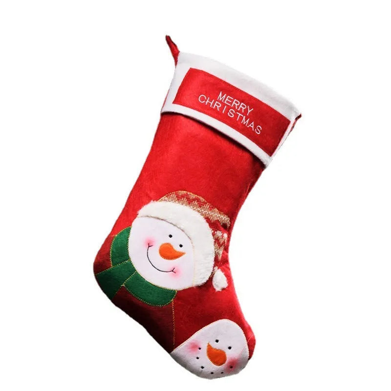 Three Christmas stocking ornaments showing elk, elderly gentleman and snowman designs in American folk art style