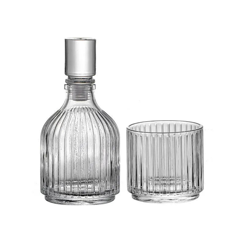 Clear glass cup and pot set with striped and diamond pattern designs for whiskey or wine