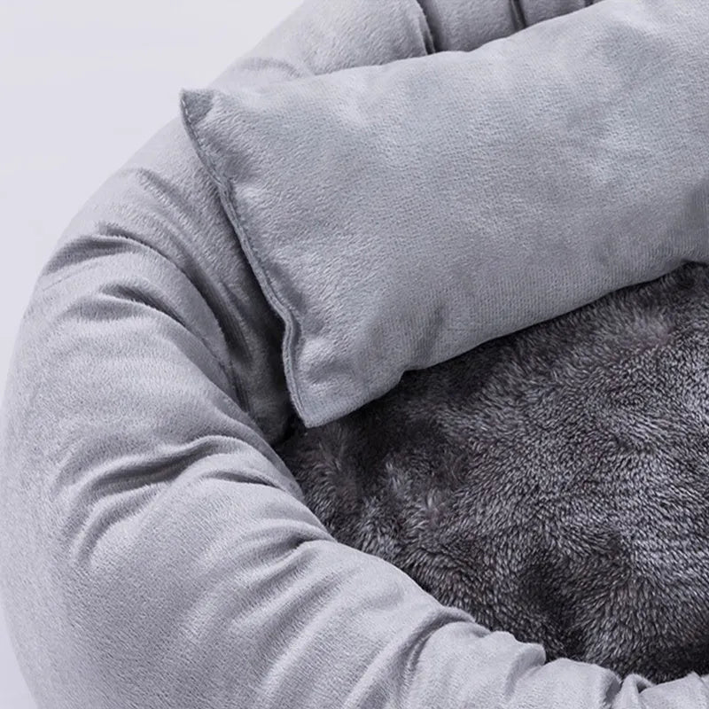 Gray round flannel pet bed for small dogs and cats with pillow on non-slip base