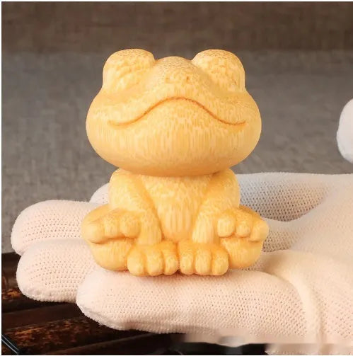 Solid bamboo smiling frog cartoon ornament measuring 5cm tall.