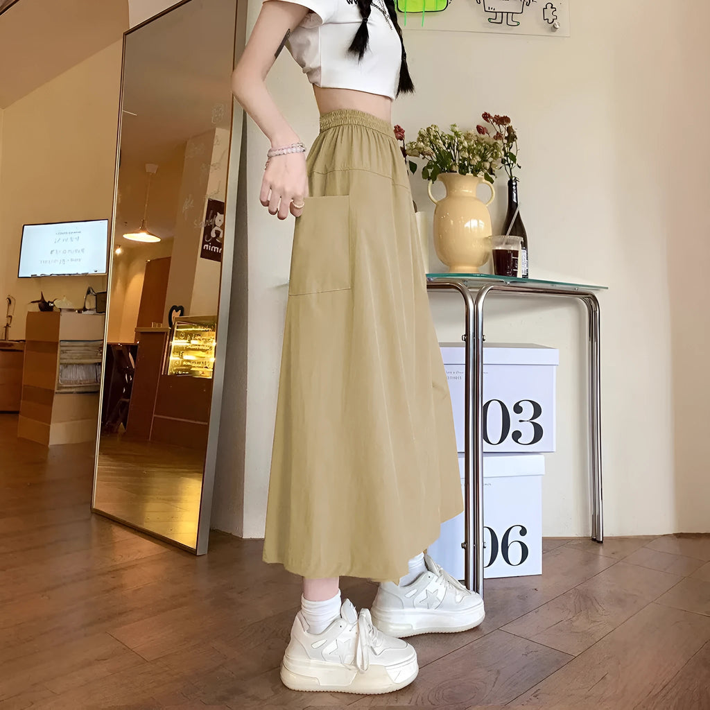 Camel women's casual loose fit a-line skirt with elastic waist on model