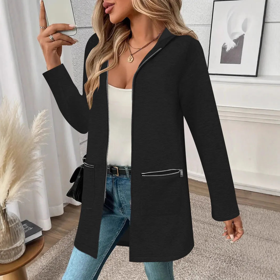 Women's loose casual mid-length cardigan coat in black with side pockets on a model