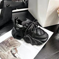 Women's wedge platform sneakers in creamy white with cross strap detail and lace-up front