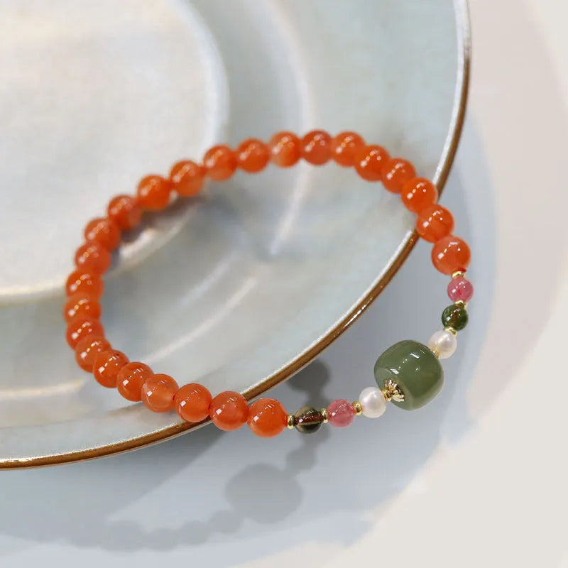 Natural Sichuan south red agate bracelet round bead retro women's jewellery on light background