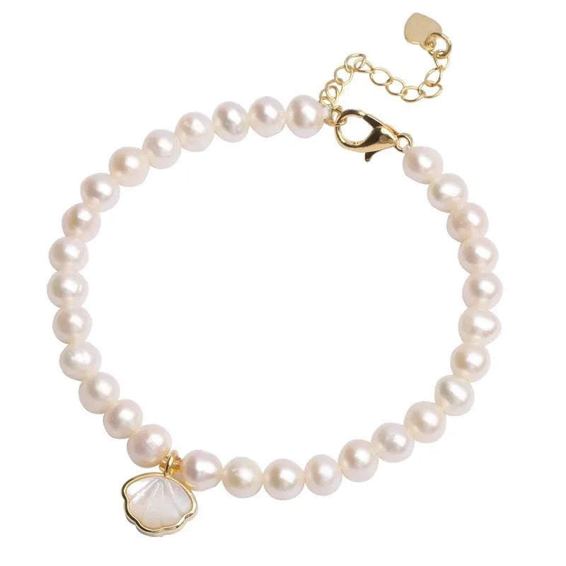 Women's freshwater pearl bracelet with fan-shaped pearl cluster and choice of elastic or chain fastening.