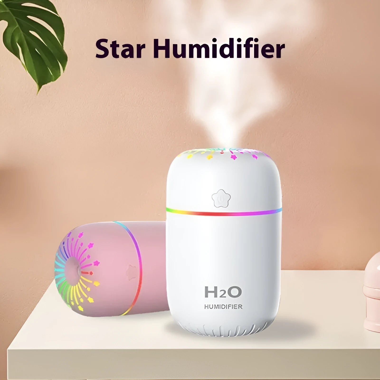 White USB mini humidifier with 300ml water tank on a desk next to a laptop