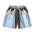 Blue patchwork quick-drying shorts with loose straight-leg styling and micro-elastic waistband