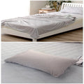 Blue cooling blanket with Q-Max 0.4 cooling fibers, polyester fabric, folded on a bed