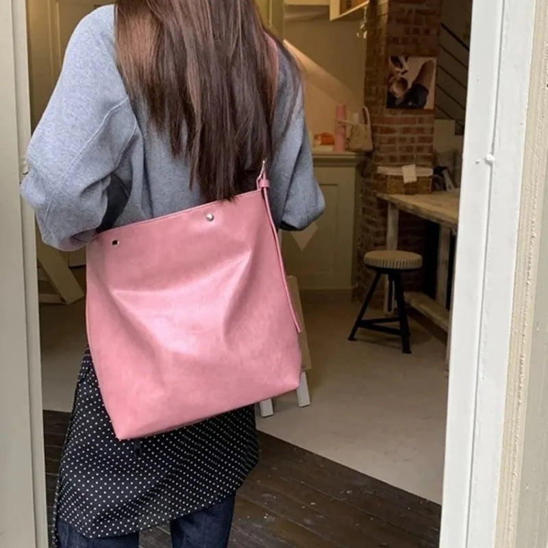 Pink corduroy one-shoulder bag with PU lining showing dimensions 39×32×11cm