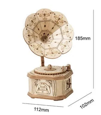 Wooden 3D puzzle model of a balloon assembled from pre-cut wood pieces on a light background