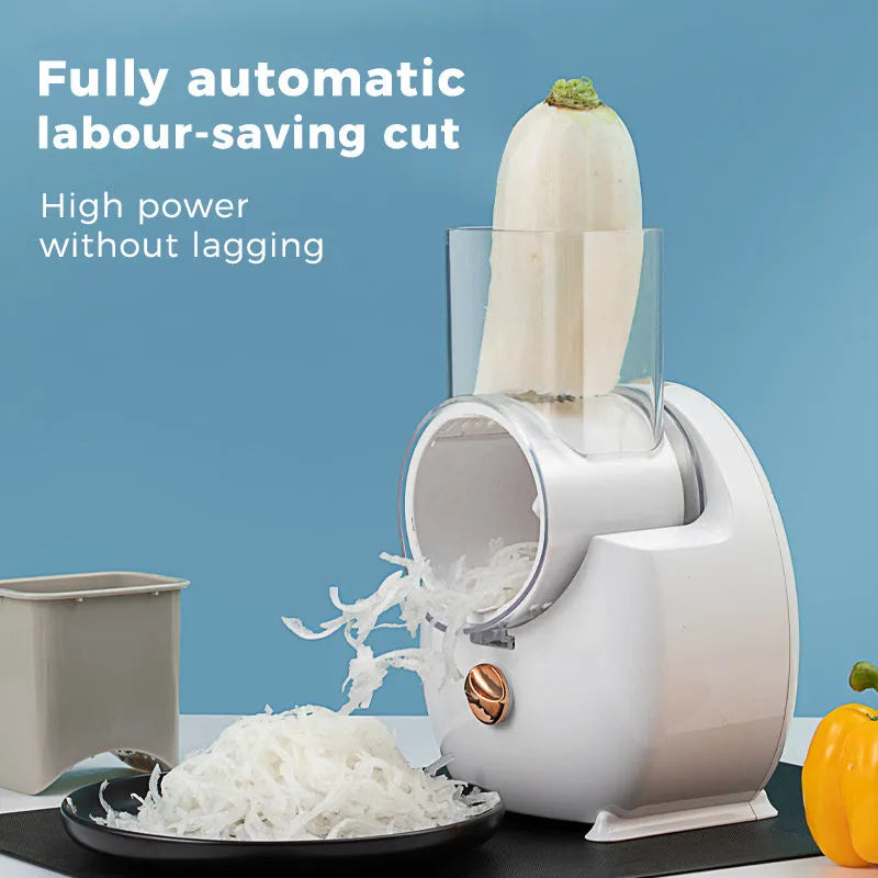 Electric vegetable slicer in white with feeding port, pressing rod, and blade barrel on a kitchen counter