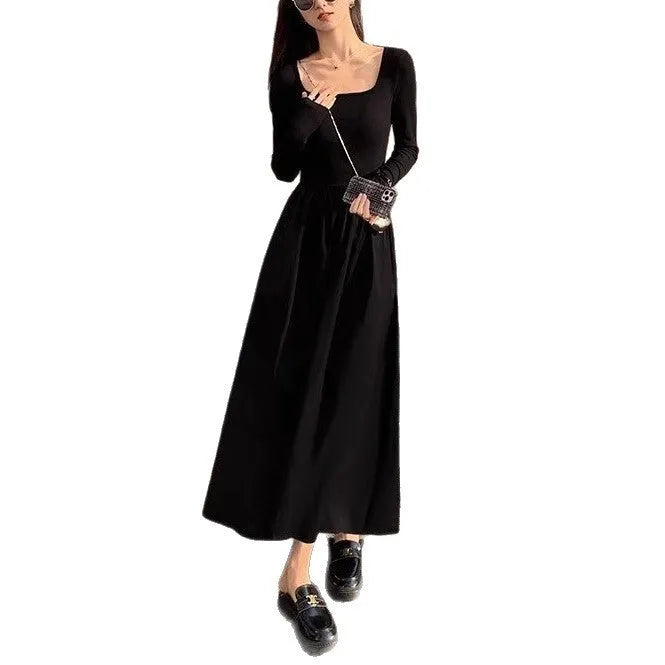 Women's black square collar knitted dress with long sleeves and an elastic A-line waist.