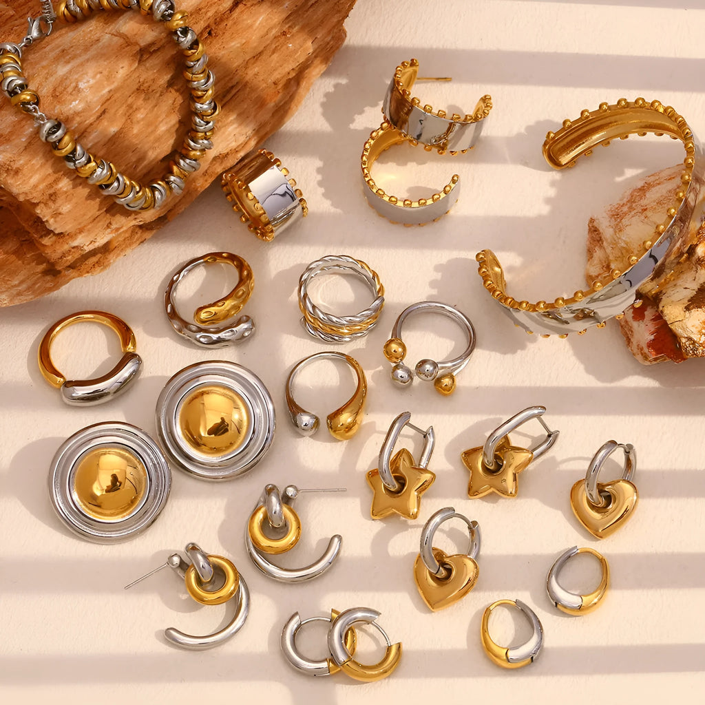 Gold stainless steel jewellery set with geometric earrings, bracelet and necklace for women