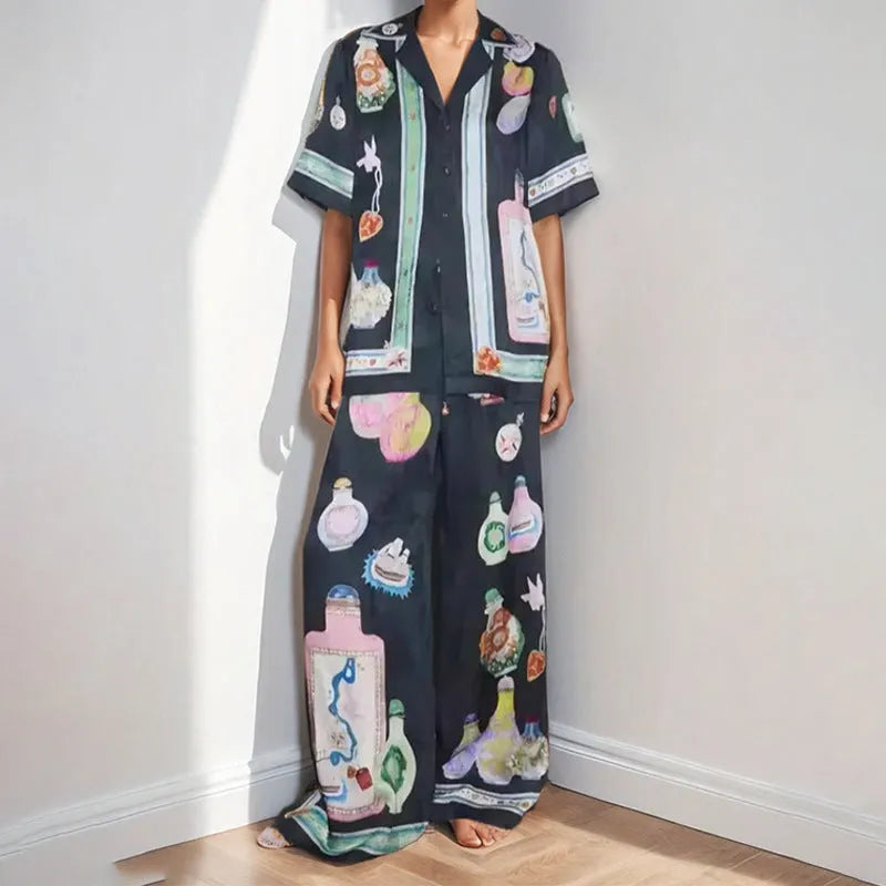Black women's casual set with cartoon print, featuring a cardigan and trousers