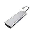 Grey aluminium USB-C docking station with HDMI, VGA, USB 3.0, and charging ports