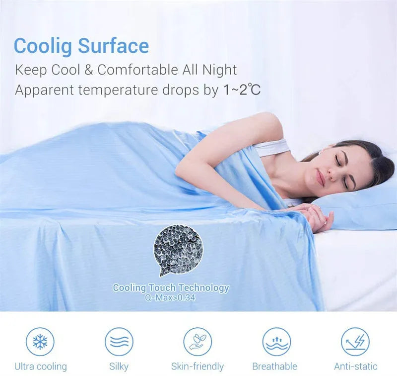 Blue cooling blanket with Q-Max 0.4 cooling fibers, polyester fabric, folded on a bed